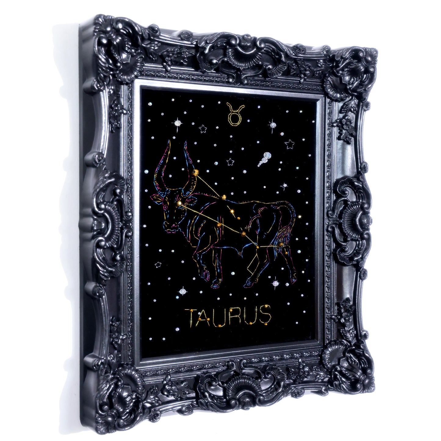 10 Inches Hand-stitched Taurus constellation embroidery on black velvet with metallic thread and rhinestone accents, set in an ornate matte-black resin frame — ready to hang.