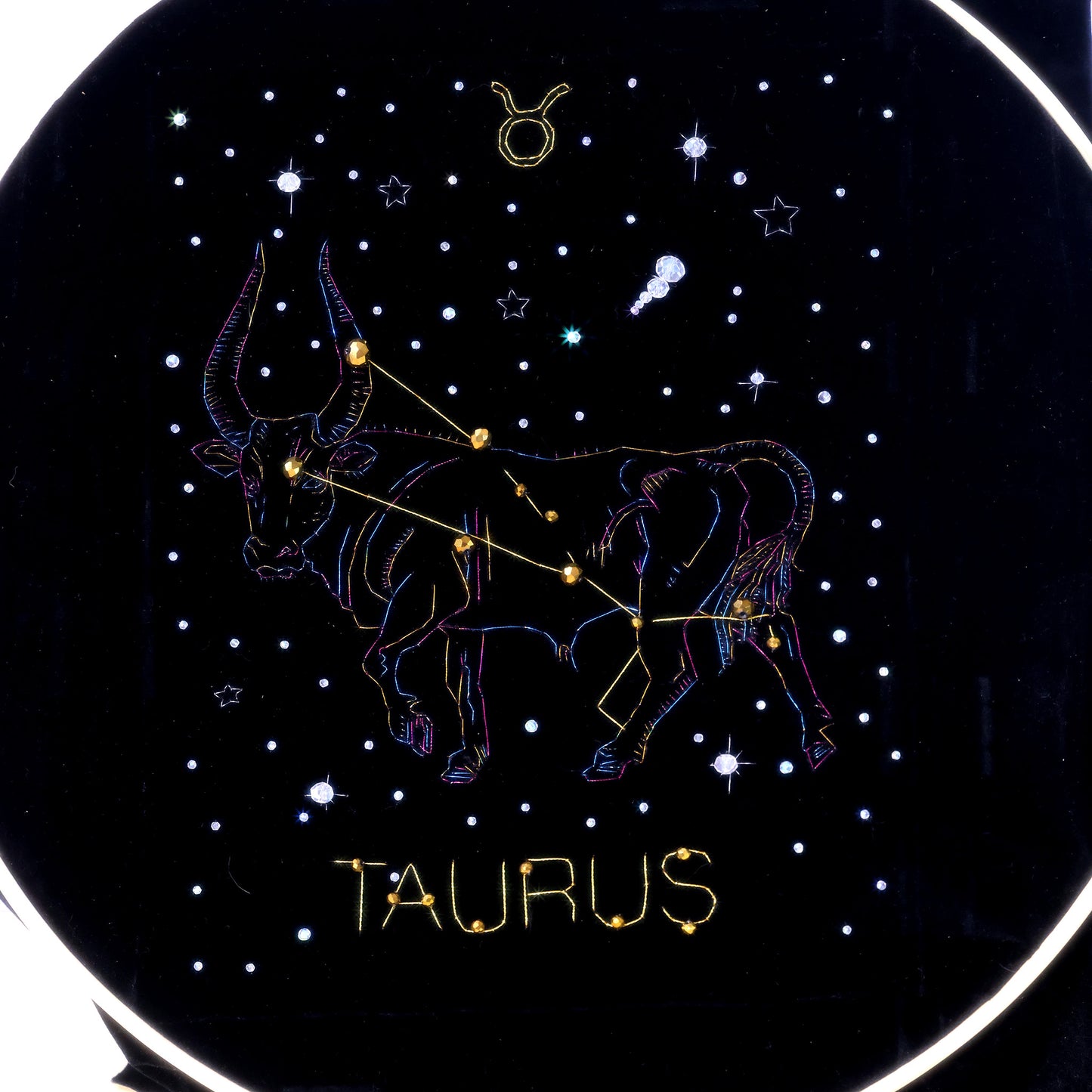 10 Inches  Hand-stitched Taurus constellation embroidery on black velvet with metallic thread and rhinestone accents, set in an ornate matte-black resin frame — ready to hang.