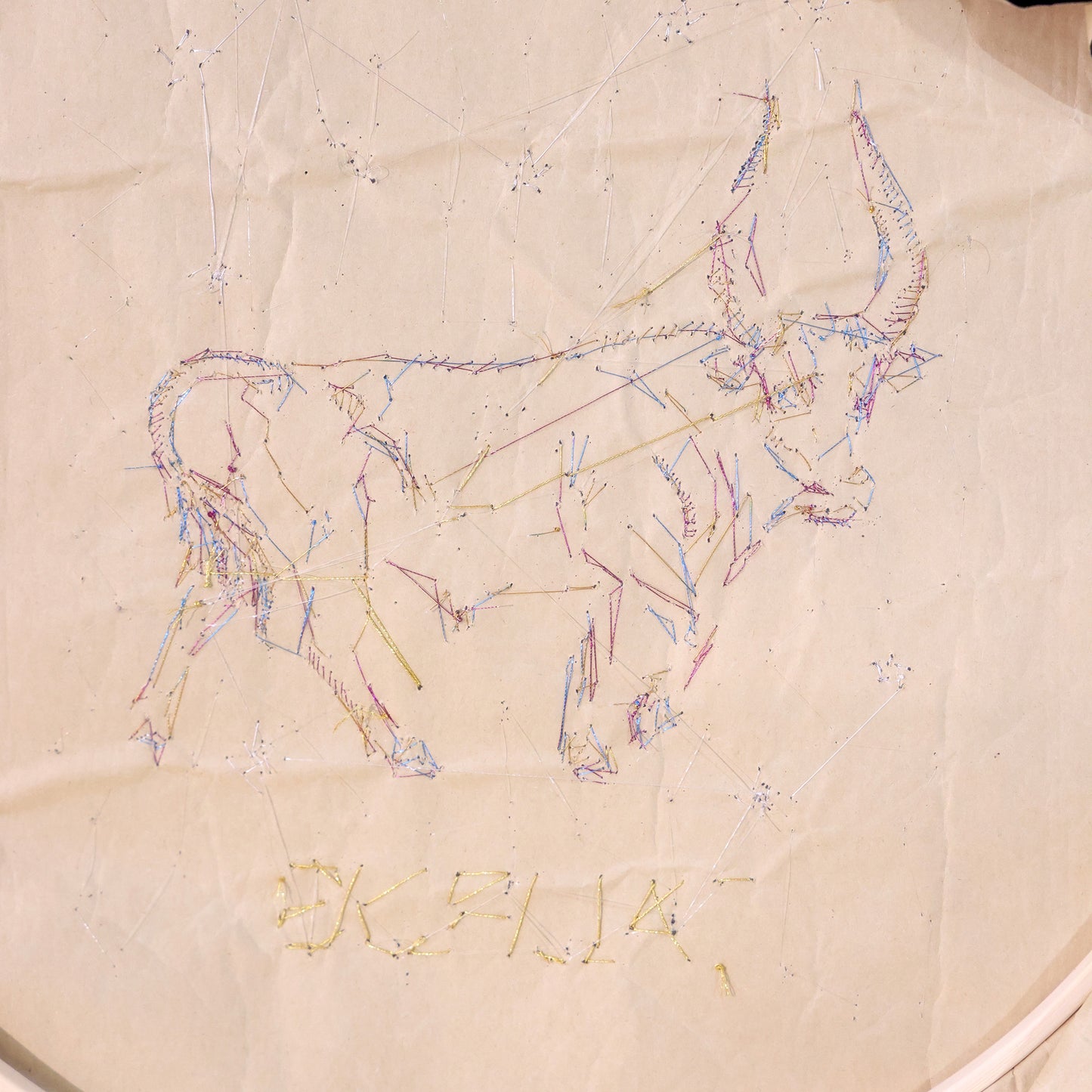 10 Inches  Hand-stitched Taurus constellation embroidery on black velvet with metallic thread and rhinestone accents, set in an ornate matte-black resin frame — ready to hang.