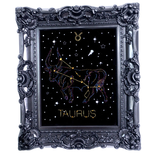10 Inches  Hand-stitched Taurus constellation embroidery on black velvet with metallic thread and rhinestone accents, set in an ornate matte-black resin frame — ready to hang.