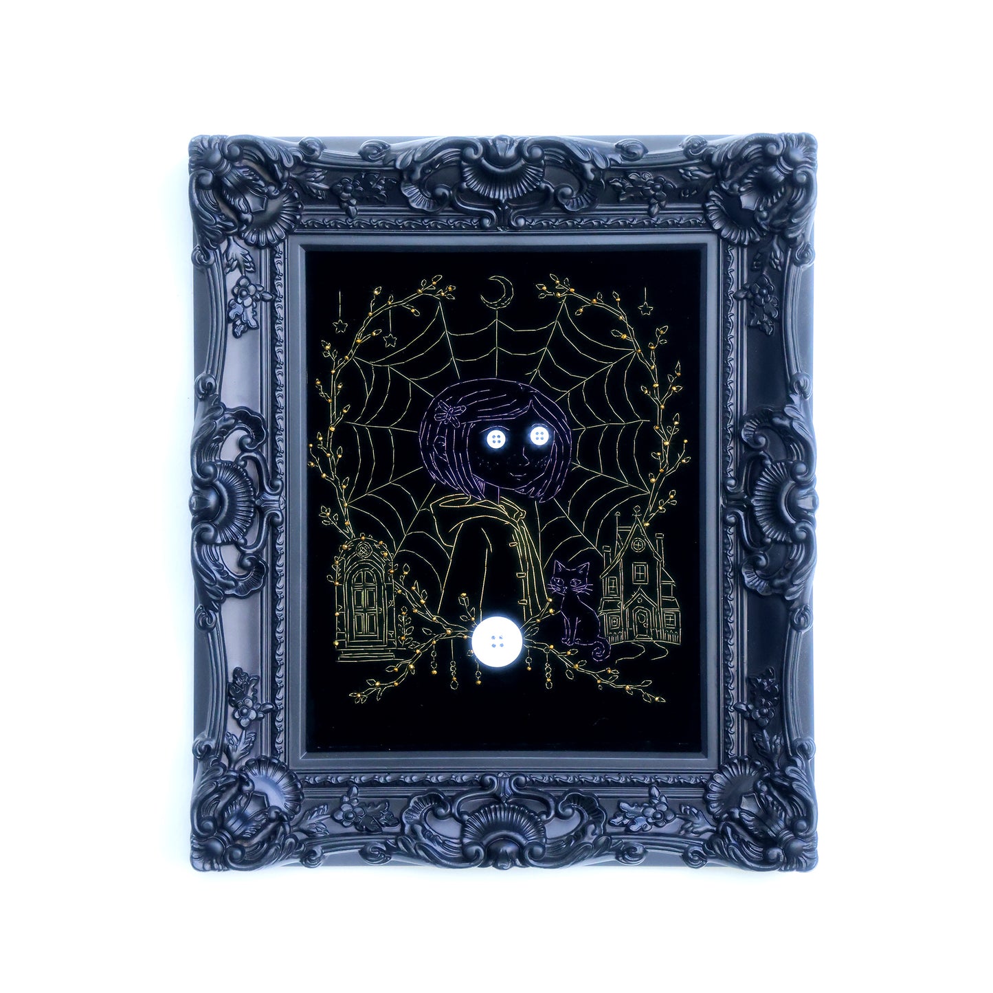10 inches Original Coraline-themed embroidered wall art on black velvet with metallic thread, rhinestones, and button eyes in an ornate black frame. Handmade, ready to hang. Contains handmade embroidered decorative paintings.