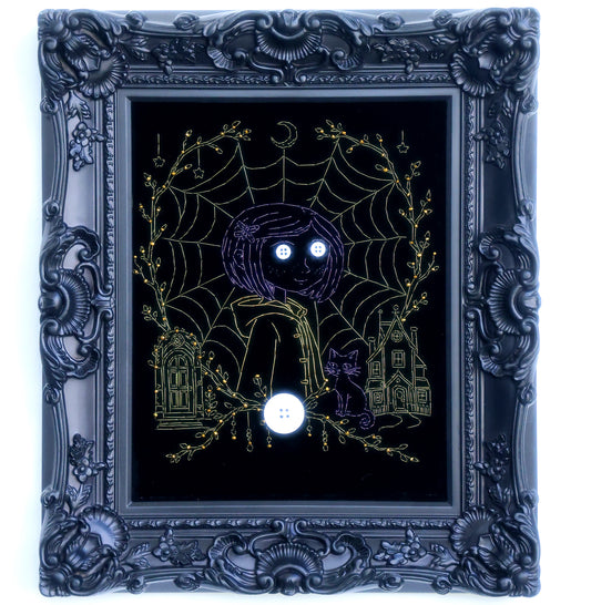 10 inches Original Coraline-themed embroidered wall art on black velvet with metallic thread, rhinestones, and button eyes in an ornate black frame. Handmade, ready to hang. Contains handmade embroidered decorative paintings.