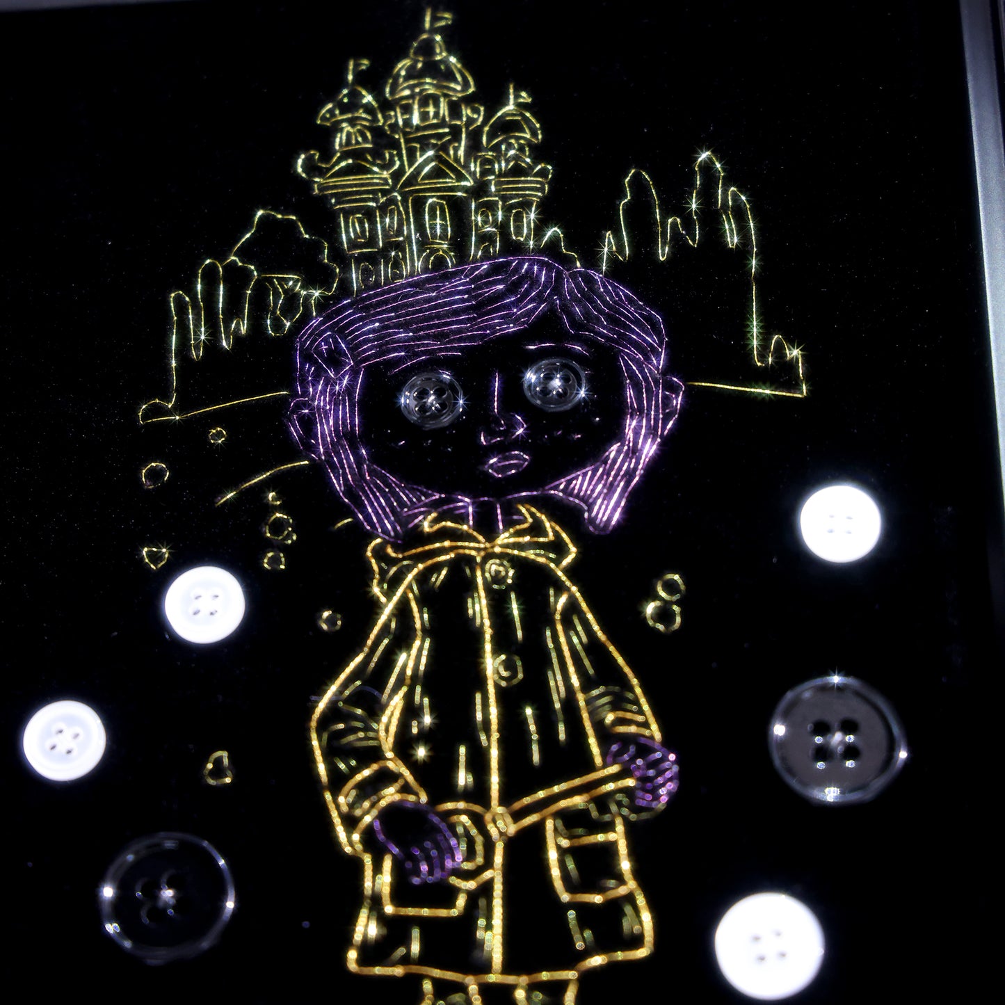 8 inches Handmade Coraline-inspired embroidered wall art on black velvet with metallic thread, buttons, and rhinestone accents in a matte ornate black frame — intentionally unglazed to showcase texture. Contains handmade embroidered decorative paintings.
